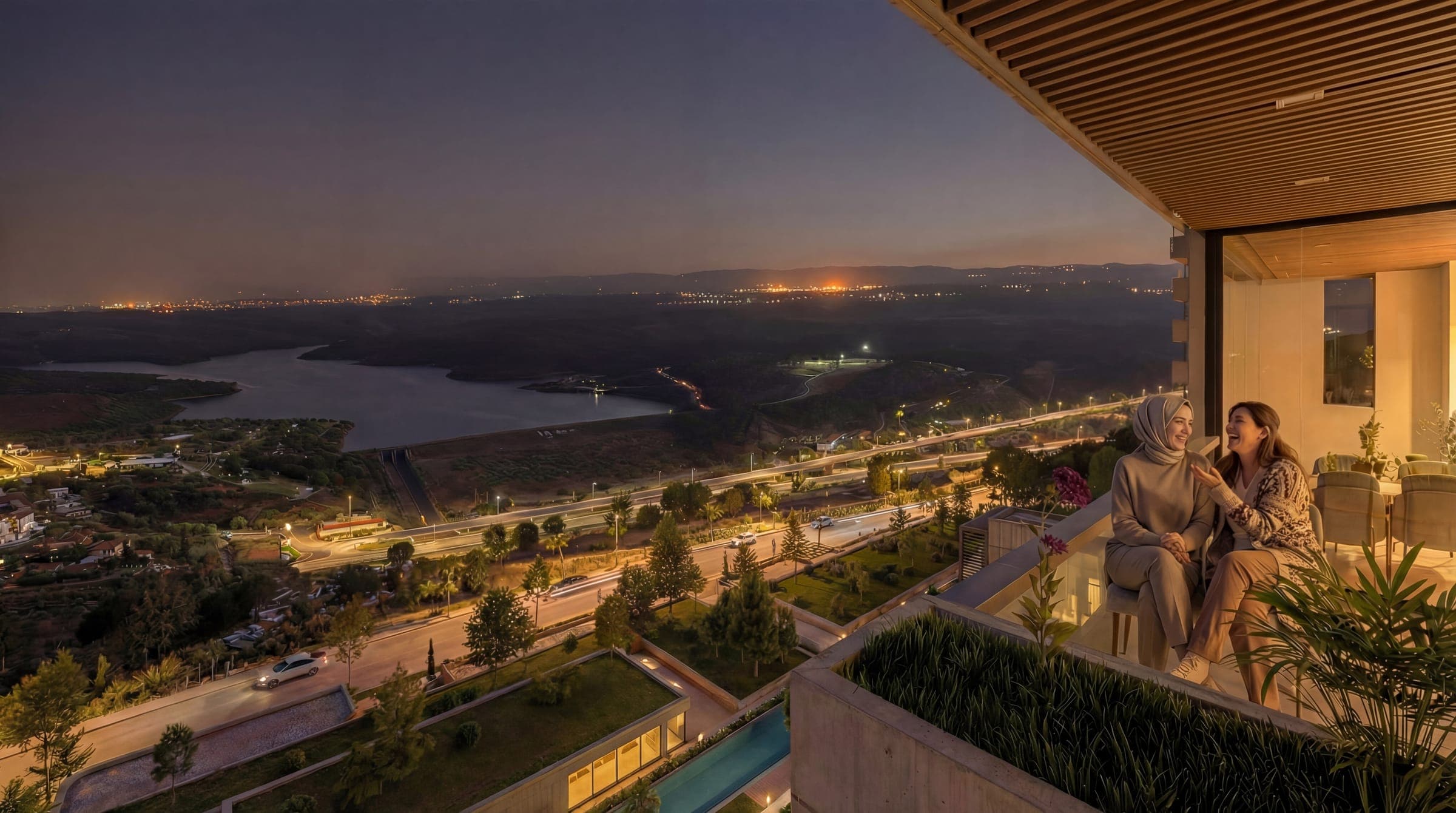 V Yeşilada dairesinin terasından gece manzarası; göl ve şehir silueti