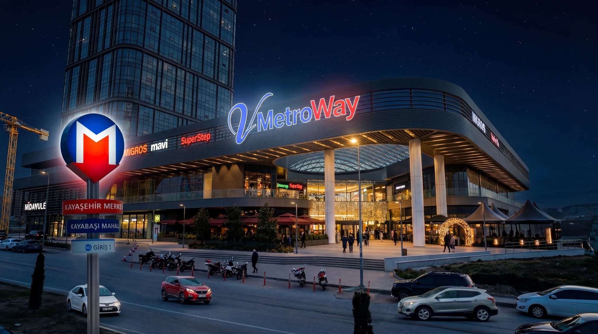 V Metroway'in gece aydınlatmalı cephesi ve önündeki Kayaşehir metro tabelası